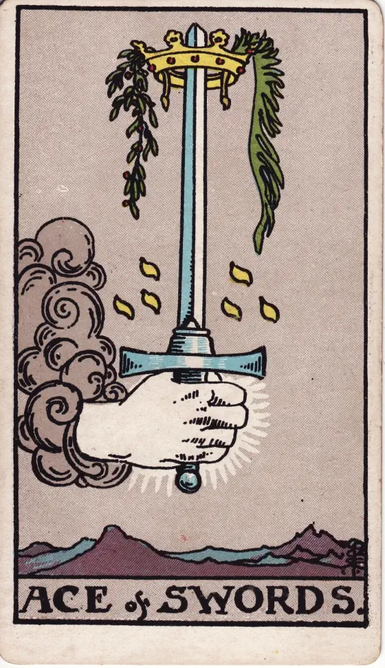 Ace of Swords: A hand issues from a cloud, grasping a sword, the point of which is encircled by a crown.