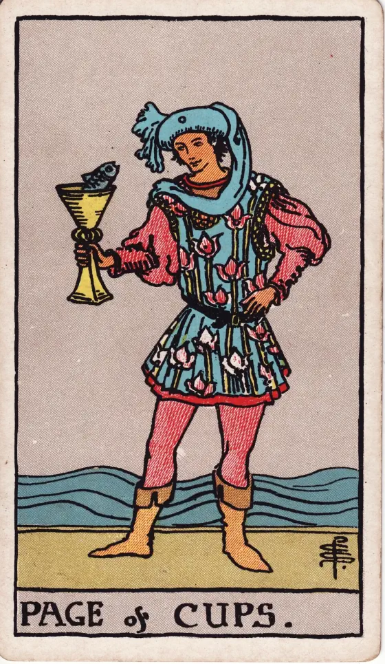 Page of Cups: A fair, pleasing, somewhat effeminate page, of studious and intent aspect, contemplates a fish rising from a cup to look at him.