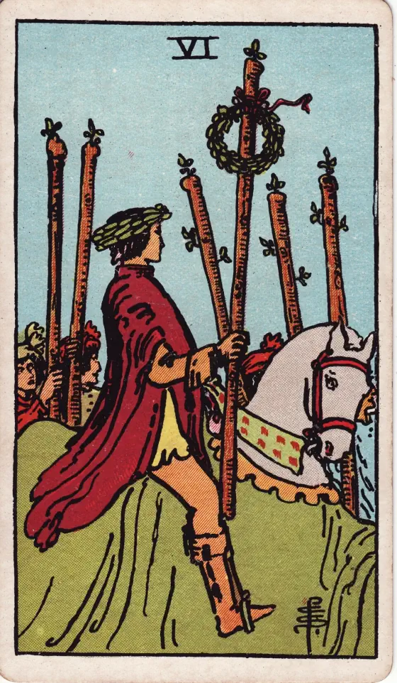 Six of Wands: A laurelled horseman bears one staff adorned with a laurel crown; footmen with staves are at his side.
