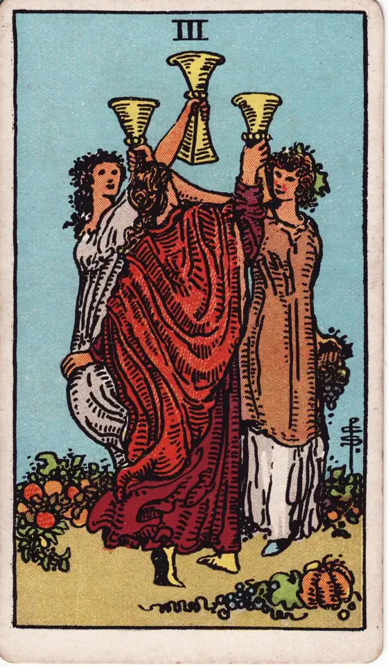 Three of Cups: Maidens in a garden-ground with cups uplifted, as if pledging one another.