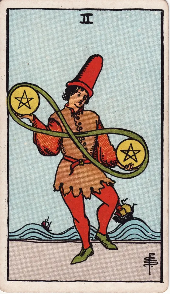 Two of Pentacles: A young man, in the act of dancing, has a pentacle in either hand, and they are joined by that endless cord which is like the number 8 reversed.